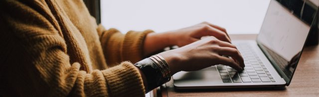 Person typing on a laptop