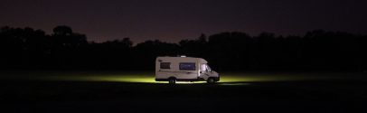 Class B campervan parked at night