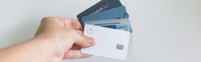 A person holding multiple credit cards