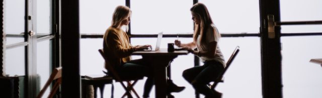 Two people sitting at a table