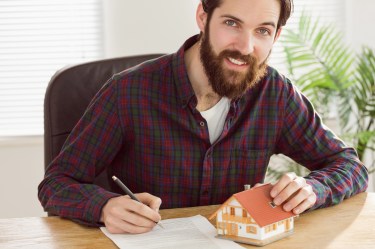 Man filling out mortgage application