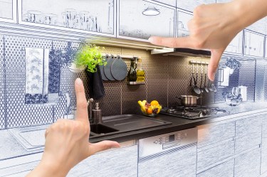Female hands framing custom kitchen design